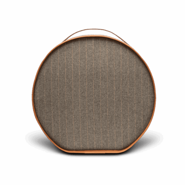 Round fabric-front portable speaker with leather handle